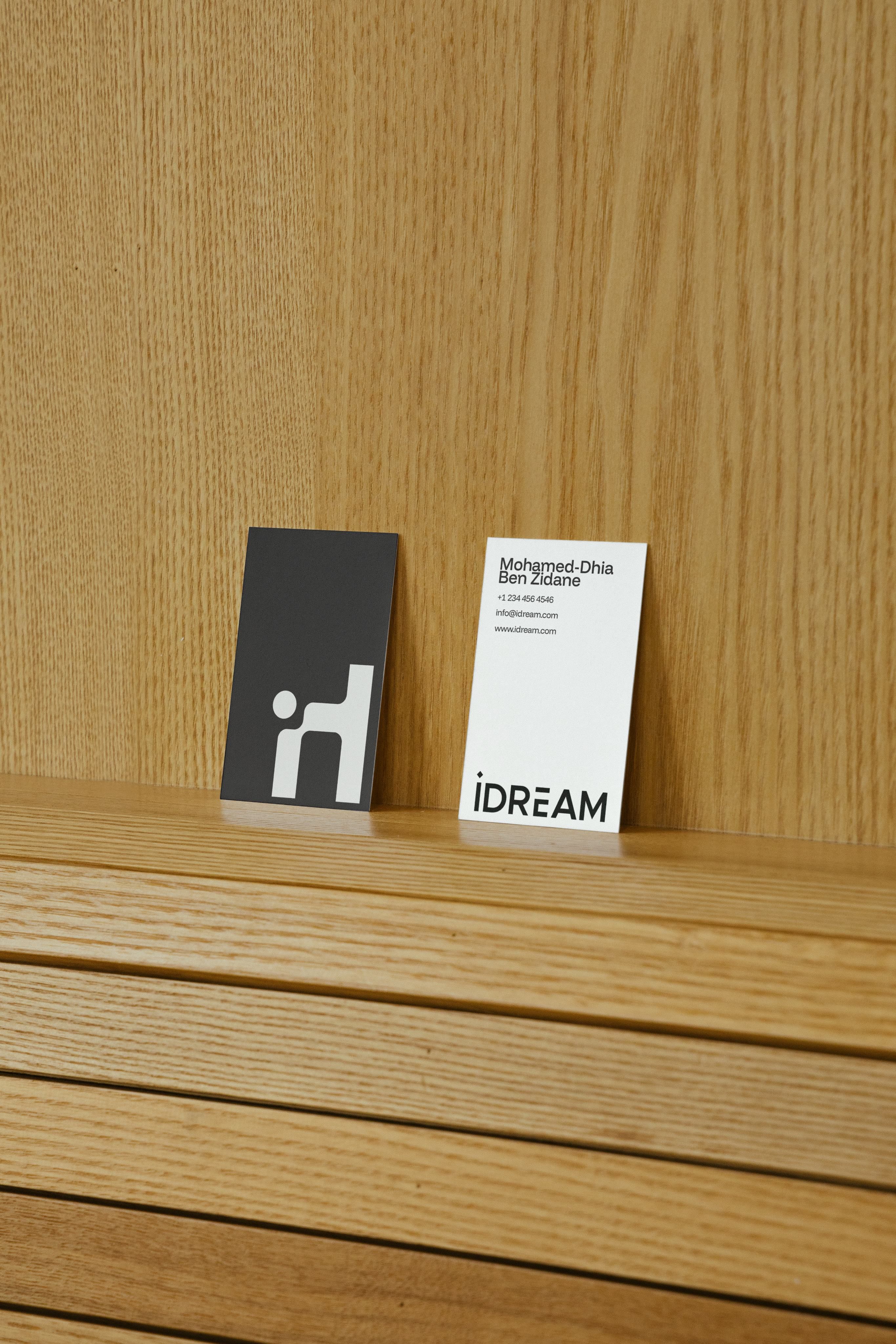 idream Business Cards - Brand stationery on wooden surface